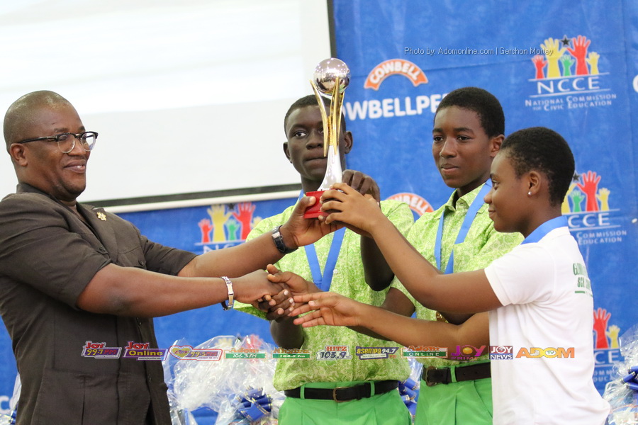 winners being presented a trophy